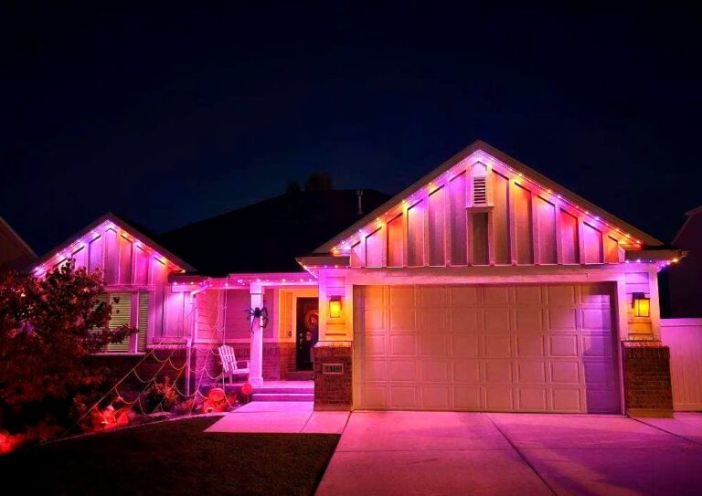 A house showcasing purple lights on both the front and side, contributing to a striking and colorful exterior appearance.